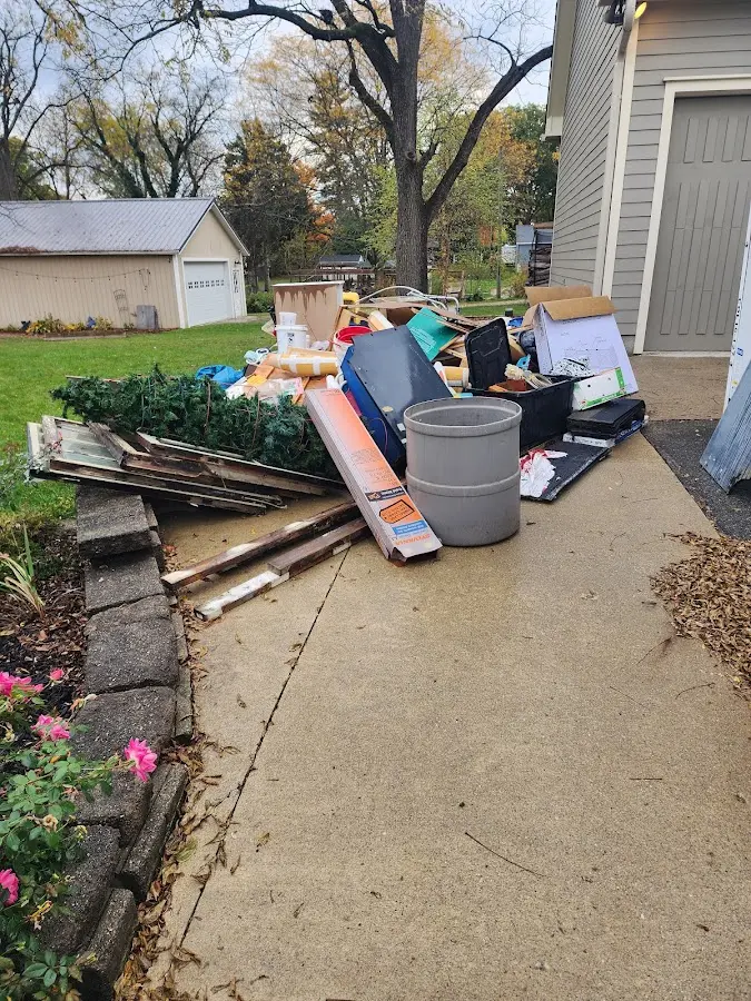 Dumpster being loaded with debris for Residential Dumpster Rental in Sugarcreek